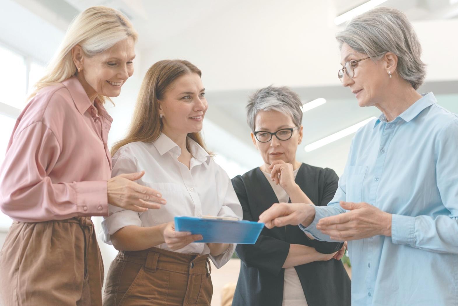 Franco Cascano reviewing investment portfolios with students in a learning session